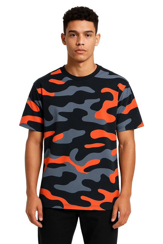Person wearing a black, gray, and orange camouflage t-shirt on a white background